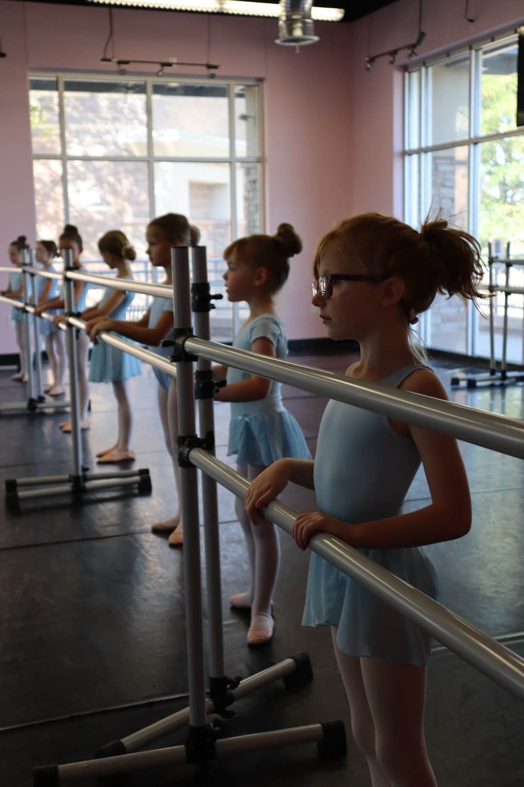 Young dancers at the barre during a DanceSpace class